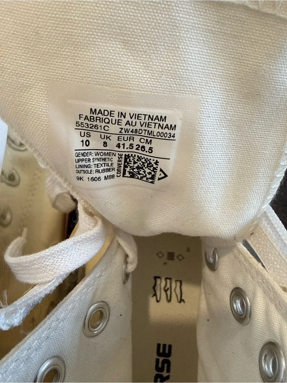 Converse white High Top Sneakers with vinyl zip cover.